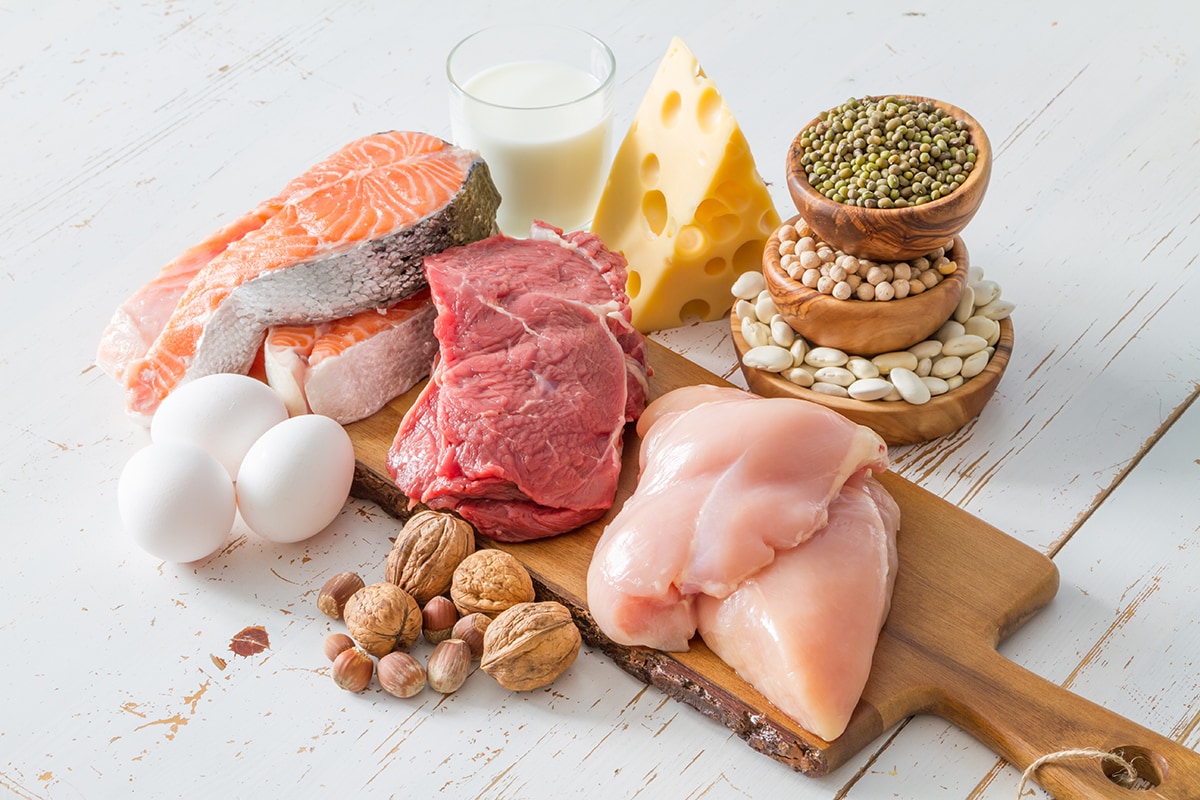 Selection of protein sources in kitchen background, copy space