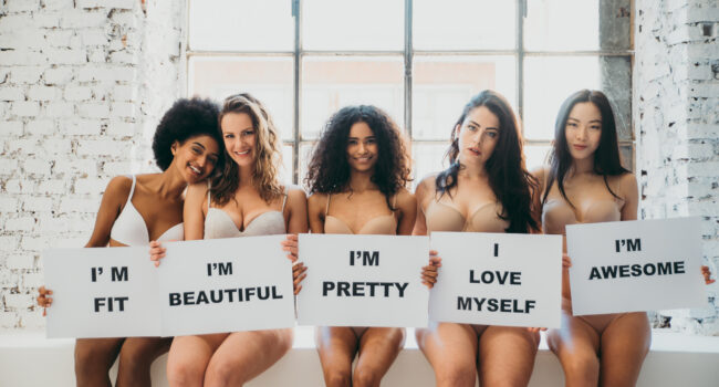 Group of women with different body and ethnicity posing together to show the woman power and strength. Curvy and skinny kind of female body concept